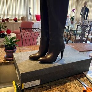 Brown high heeled boots. Never worn!  Beautiful boots.